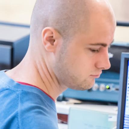 A photo of me working at a computer.